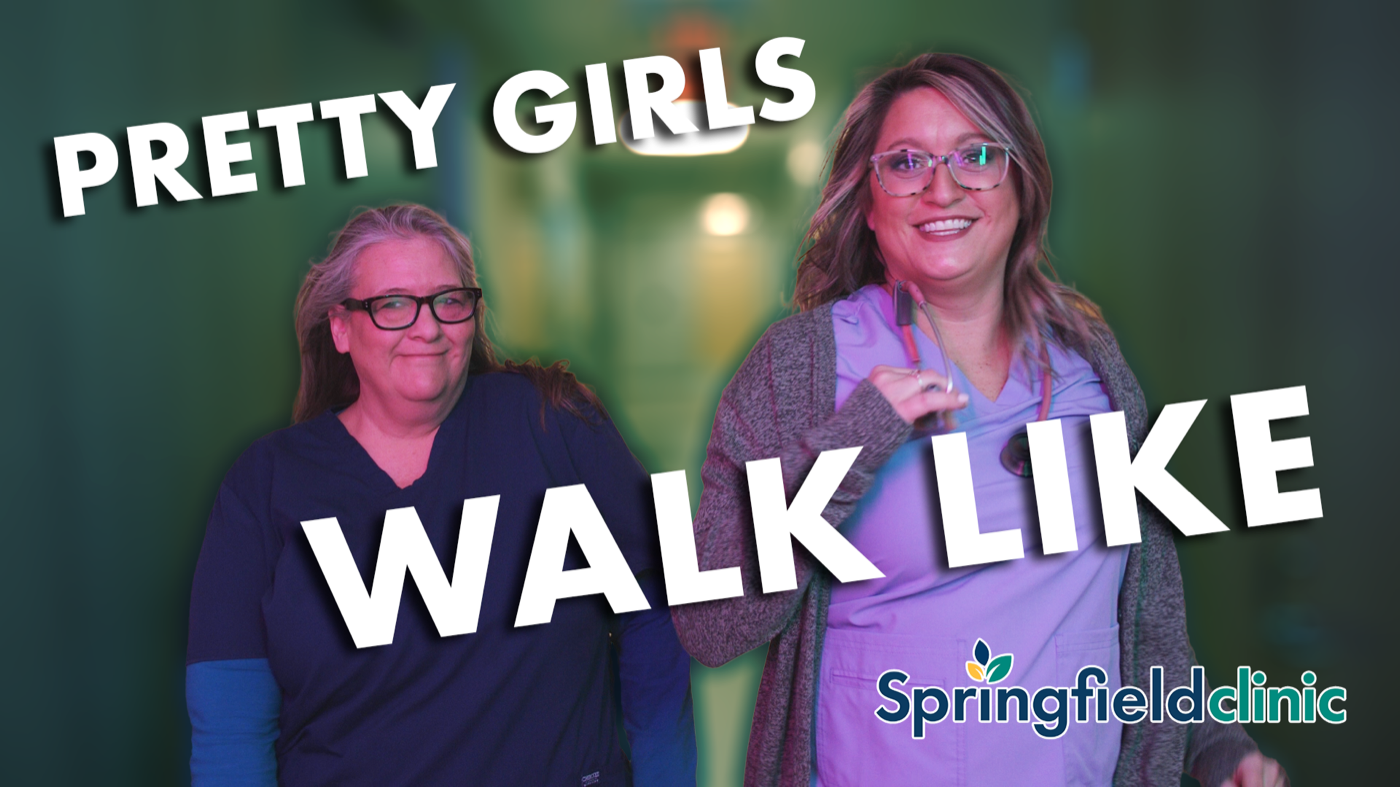 Two Springfield Clinic team members in a fun "Pretty Girls Walk" trend